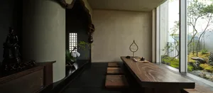 Rustic kitchen with a wooden table and benches, surrounded by a stone wall, with a vase on the table and dim lighting