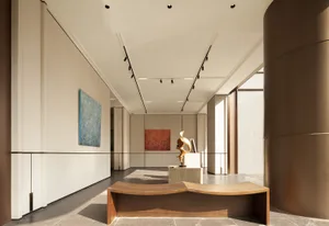 A large, open room with a wooden floor, featuring three paintings on the walls and a sculpture on a pedestal, in a contemporary style with a focus on art pieces and open layout