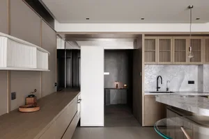 Modern kitchen and dining area with a wooden floor, white refrigerator, and potted plant, featuring a mix of natural and artificial lighting