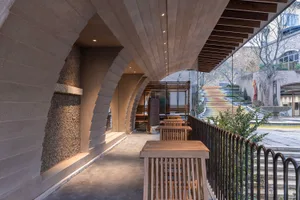 Warm and inviting restaurant with a wooden floor, dining area, and natural light
