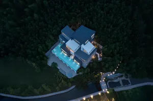 A serene and inviting modern house with a concrete exterior, a blue swimming pool, and a tree-lined backyard
