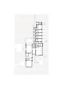 A simple hand-drawn floor plan of a hotel or apartment complex with a mix of open and enclosed areas, featuring a calm and organized design