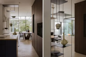 Modern kitchen with dining area, white surfaces, natural light, and various appliances