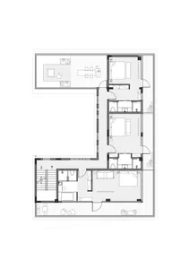 Two-story residential floor plan with modern design, white walls, and natural light from windows