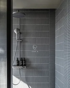 Bathroom with a shower and black and white tiles, minimalistic and functional design with clean lines and simple layout