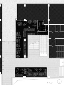 Black and white floor plan of a commercial building with room outlines, labels, measurements, and symbols, featuring a minimalist layout and natural lighting