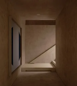 Dimly lit room with a wooden floor and staircase in the corner, minimalist style