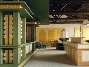 A modern living and dining space with a wooden floor, yellow walls, and a variety of furniture including a dining table, chairs, and a couch, arranged to create a comfortable and inviting atmosphere