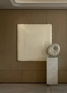 A modern room with a white wall, wooden floor, and a white sculpture on a pedestal, featuring a large white square on the wall and soft, diffused lighting