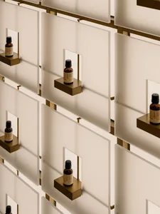 A well-lit display of bottles arranged in white boxes for sale or exhibition