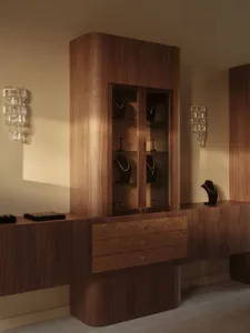 A well-organized room with a wooden desk, cabinet, and various items, featuring soft and diffused lighting