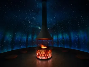 Cozy room with a stone wall and a burning fireplace, creating a warm atmosphere