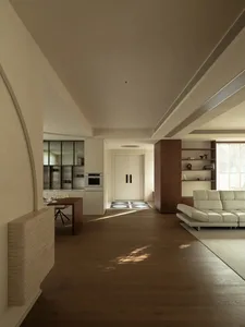 Cozy living room and kitchen area with a wooden floor, white furniture, and natural light