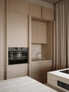 Modern kitchen with wooden cabinets, a black oven, and a bottle on the countertop, featuring a clean and minimalist design with soft, warm lighting