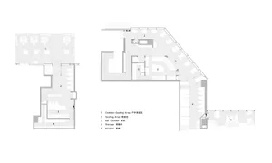 Large modern room with a staircase and several other rooms, featuring clean lines and minimal decoration