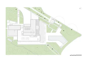 A simple 2D floor plan of a house with a natural setting, surrounded by trees, with sunlight shining on the building, highlighting its traditional and rustic features