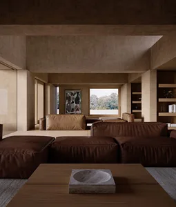 A well-lit living room with a leather sofa, a chair, and a dining table, surrounded by clean lines and minimalistic design elements