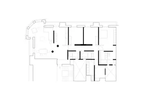 Black and white floor plan of a minimalist building with a clean and organized layout