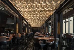 A modern restaurant with a semi-circular seating arrangement, wine glasses, and vases on tables, surrounded by a mix of black and brown colors and various materials, with soft and warm lighting