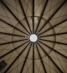 Large, open space with a dome-shaped metal ceiling and natural lighting