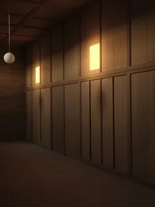 A large, empty room with wooden walls, a wooden floor, and two lights, one on each side, creating a warm and natural ambiance