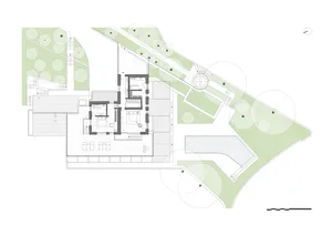 A simple white drawing of a residential floor plan with a large room and a smaller room with a sink and refrigerator