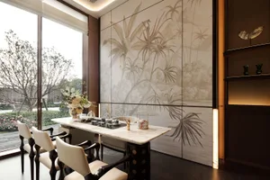A modern dining room with a wooden dining table and chairs, surrounded by a large window with natural light, creating a bright and inviting atmosphere