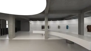 A modern and minimalist room filled with clothing items, featuring a white floor and counter, with dim lighting creating a subdued atmosphere