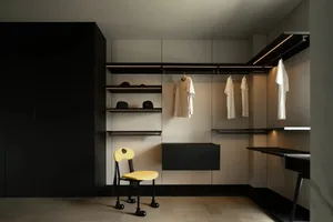 A small black and white room with a yellow chair and a hanging shelf, featuring a classic and timeless aesthetic