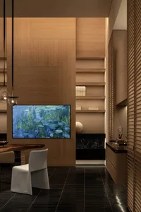 A modern living room with a dining table, couch, and various furniture pieces, well-lit and inviting