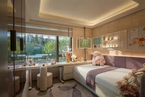 A modern bedroom with a bed, desk, and teddy bear, featuring wood furniture and a combination of white and grey walls and bedding, in a well-lit space