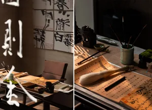 A cluttered room with a mix of furniture, decorations, and artwork, featuring a dining table, chair, couch, books, Asian art, and a painting and sculpture