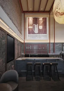 A modern bar with a black counter, brown and white decor, and black stools, featuring a TV on the wall and dim lighting