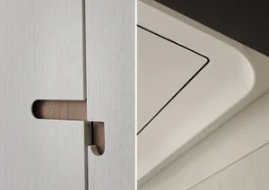 White kitchen cabinet with a wooden handle and a white wall with a vent