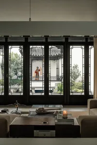 Cozy living space with a fireplace, wood furniture, and dim lighting