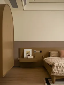 Cozy bedroom with a brown bed, dresser, and picture, set against a brown background, with a white comforter and dim lighting