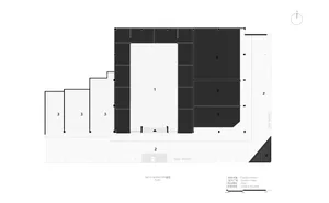 Black and white floor plan of a large room with furniture and linework indicating room dimensions and layout