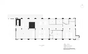 Large open space with modern rooms, white walls, and natural light from windows