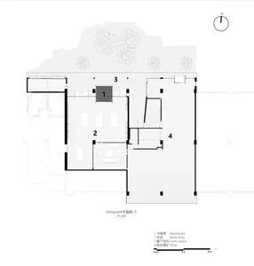 Black and white floor plan of a modern building with multiple rooms, including a living room, dining room, and kitchen, featuring clean lines and minimal decoration