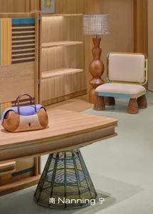 A modern study room with a wooden floor, a wooden table, and a bookshelf with a lamp, a chair, and a cozy atmosphere