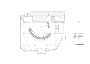A 2D floor plan of a large room with a circular seating area, surrounded by chairs, and filled with chairs, with room outlines, labels, measurements, and symbols