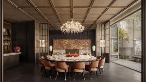 A modern dining room with a round table, chairs, and a chandelier, set with plates, wine glasses, and bowls, surrounded by wood and glass surfaces, with soft and warm lighting