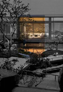 A modern building with a glass facade and a pond in the garden, showcasing the interior and architectural details