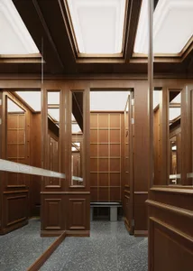A dimly lit hallway with wooden walls and doors, lined with mirrors to create an illusion of depth