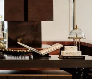 A cozy kitchen with a wooden counter, two books, a cake, and a bowl, creating a warm and inviting atmosphere