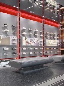 A modern shoe store with a colorful display of shoes on the wall, set against a clean and sleek background, with well-lit and inviting atmosphere