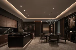 Modern kitchen and dining room with a wooden kitchen island, chandelier, and dim lighting creating a cozy atmosphere