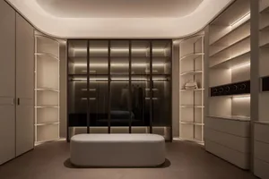 A well-lit bedroom with a bed, bench, and closet, featuring wood and fabric materials in a cozy and inviting space