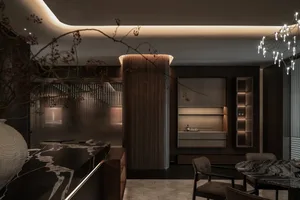 A well-lit modern kitchen with wooden cabinets, a dining table, and chairs, surrounded by natural materials and clean design elements