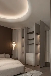A well-lit bedroom with a bed, dresser, and bookshelf, creating a comfortable and inviting atmosphere